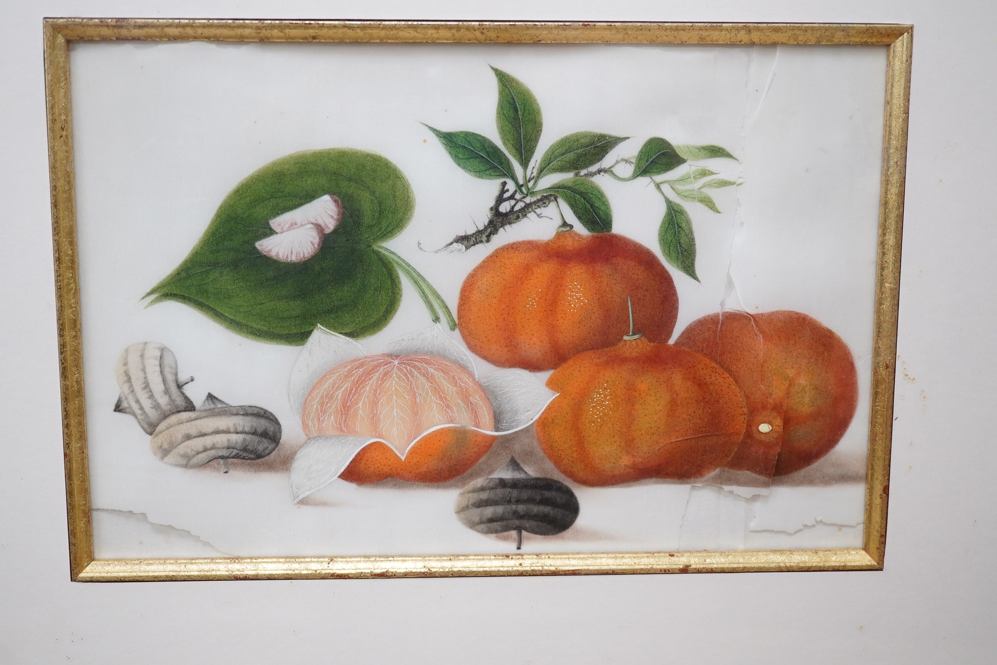 Mid 19th century, Chinese School, set of four pith paintings, Still lifes of fruit and vegetables, 18 x 26cm. Condition - poor, rips to the paper